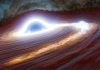 “Eruptie cosmică fără precedent: O gaură neagră strălucește mai puternic decât 10 trilioane de sori”